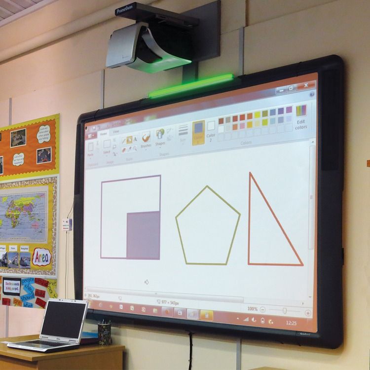 Classroom interactive whiteboard with babbleguard product light above it glowing green